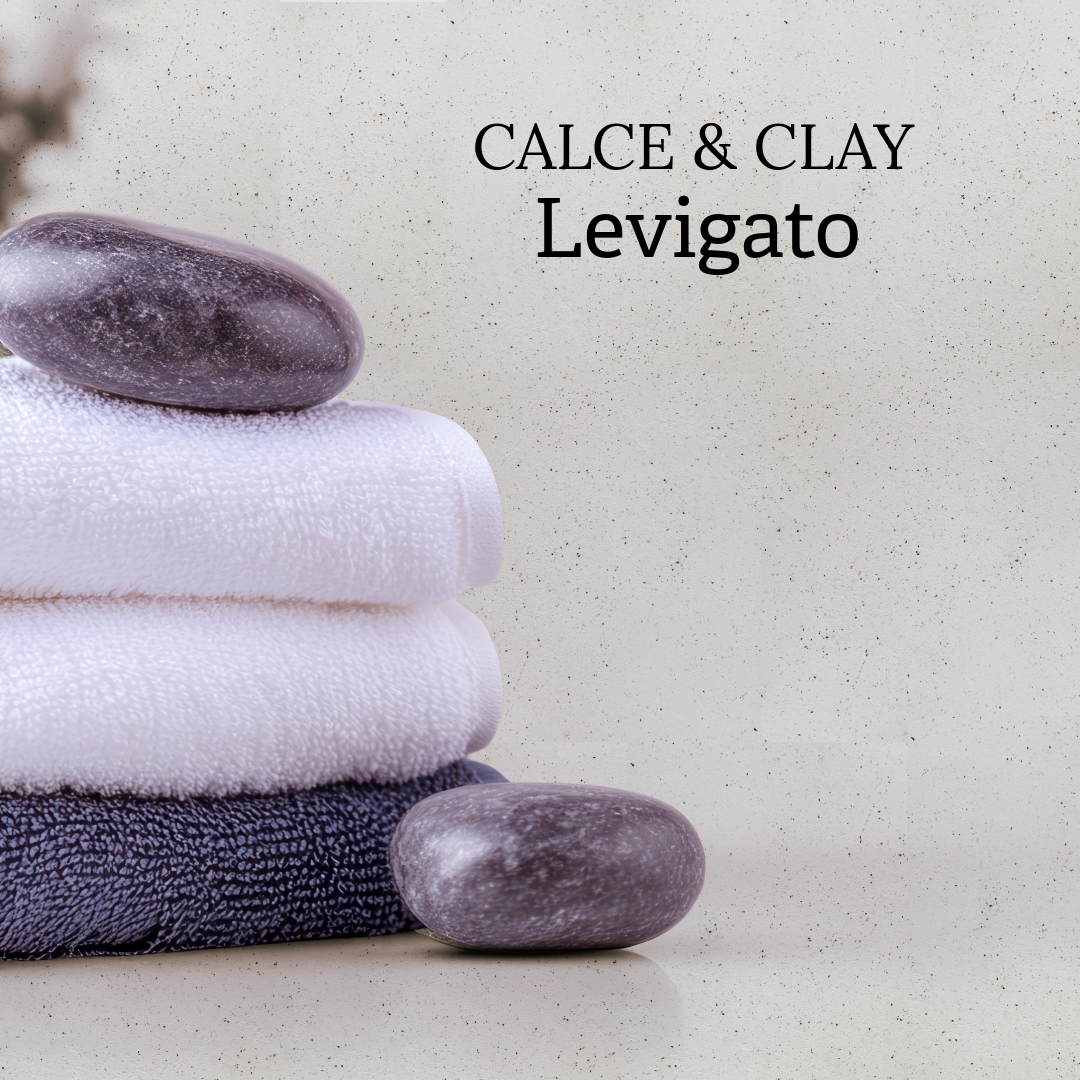 Smooth lime and clay wall finish with lava stone granules and soft matte texture